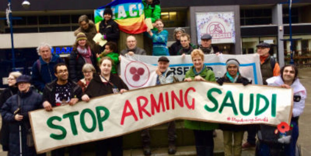 Group of people behind a big banner