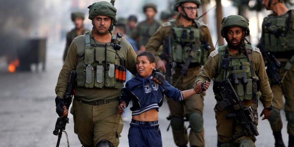 children being manhandled by soldiers