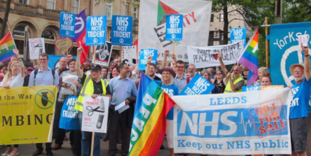 People with banners demonstrating in Leeds