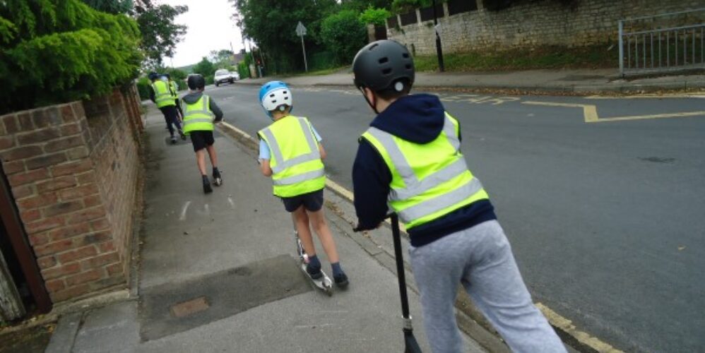 children on scooters