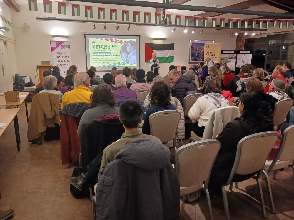 The photo shows Tricia Griffin, one of the Leeds Palestinian Film Festival committee, introducing the film.